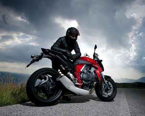 Preview wallpaper motorcycle, racer, road, sky, clouds