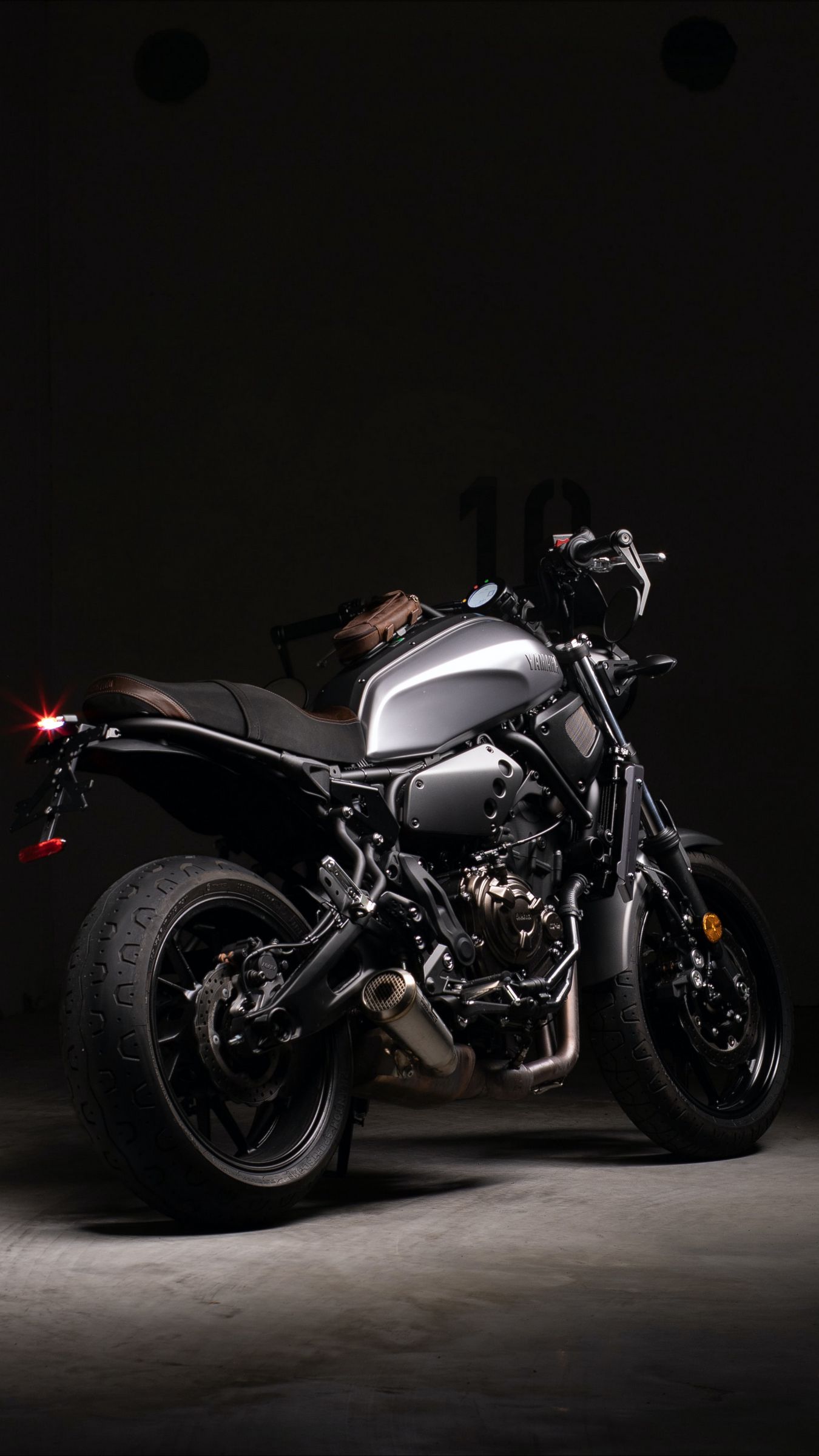 Download wallpaper 1350x2400 motorcycle, rear view, wheels, gray, dark