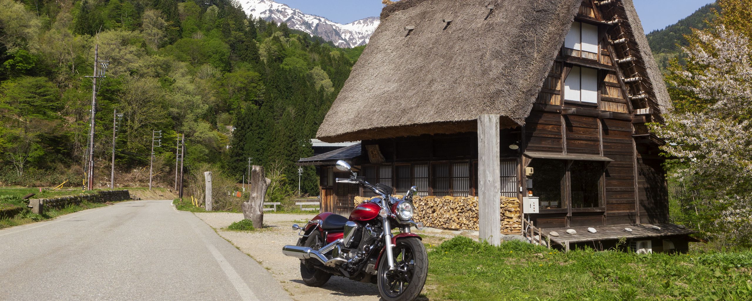 2560x1024 Wallpaper motorcycle, red, house, trees, mountain