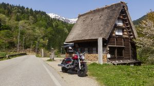 Preview wallpaper motorcycle, red, house, trees, mountain