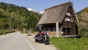 Preview wallpaper motorcycle, red, house, trees, mountain