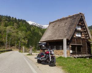 Preview wallpaper motorcycle, red, house, trees, mountain