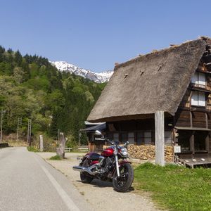 Preview wallpaper motorcycle, red, house, trees, mountain