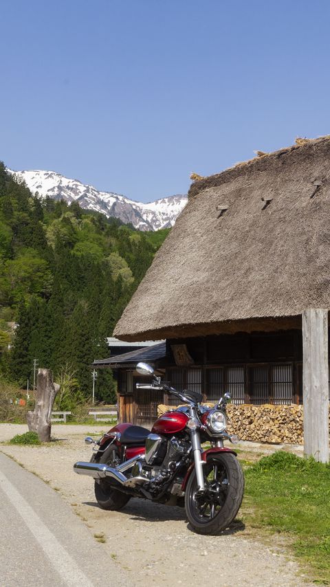 480x854 Wallpaper motorcycle, red, house, trees, mountain