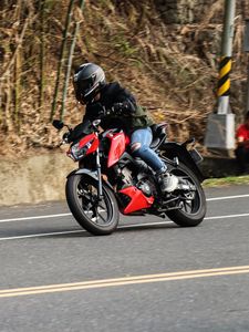 Preview wallpaper motorcycle, red, motorcyclist, road, speed