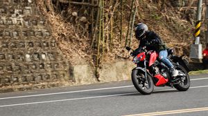 Preview wallpaper motorcycle, red, motorcyclist, road, speed