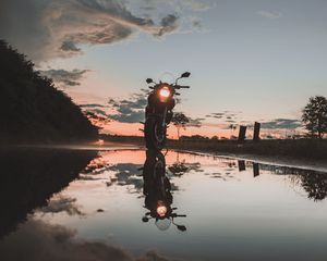 Preview wallpaper motorcycle, sunset, reflection, water, sky