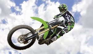 Preview wallpaper motorcycle, trick, jump, extreme, sky, clouds