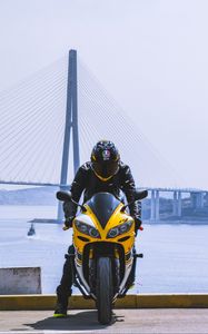 Preview wallpaper motorcycle, yellow, motorcyclist, helmet, bridge