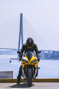 Preview wallpaper motorcycle, yellow, motorcyclist, helmet, bridge