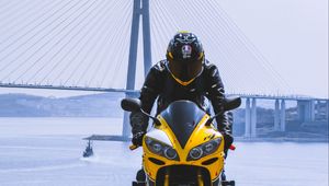 Preview wallpaper motorcycle, yellow, motorcyclist, helmet, bridge