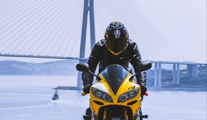 Preview wallpaper motorcycle, yellow, motorcyclist, helmet, bridge