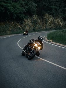 Preview wallpaper motorcycles, motorcyclist, helmet, pursuit, road