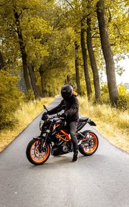 Preview wallpaper motorcyclist, motorcycle, helmet, road