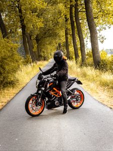 Preview wallpaper motorcyclist, motorcycle, helmet, road