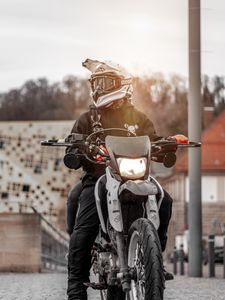 Preview wallpaper motorcyclist, motorcycle, helmet, sunlight