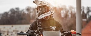 Preview wallpaper motorcyclist, motorcycle, helmet, sunlight