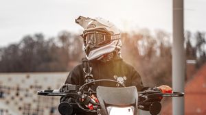 Preview wallpaper motorcyclist, motorcycle, helmet, sunlight