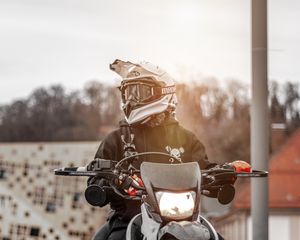 Preview wallpaper motorcyclist, motorcycle, helmet, sunlight