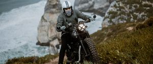 Preview wallpaper motorcyclist, motorcycle, helmet, rocks