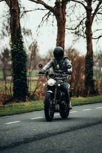Preview wallpaper motorcyclist, motorcycle, helmet, road, headlamp