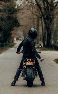 Preview wallpaper motorcyclist, motorcycle, helmet, road, rear view