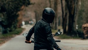 Preview wallpaper motorcyclist, motorcycle, helmet, road, rear view