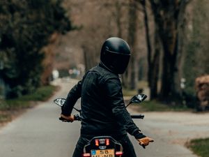 Preview wallpaper motorcyclist, motorcycle, helmet, road, rear view