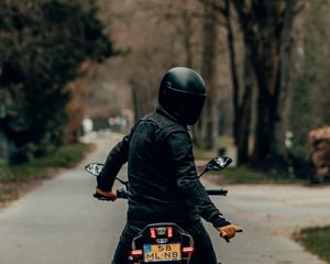 Preview wallpaper motorcyclist, motorcycle, helmet, road, rear view