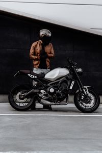 Preview wallpaper motorcyclist, motorcycle, helmet, gloves, black
