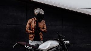 Preview wallpaper motorcyclist, motorcycle, helmet, gloves, black