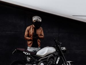 Preview wallpaper motorcyclist, motorcycle, helmet, gloves, black