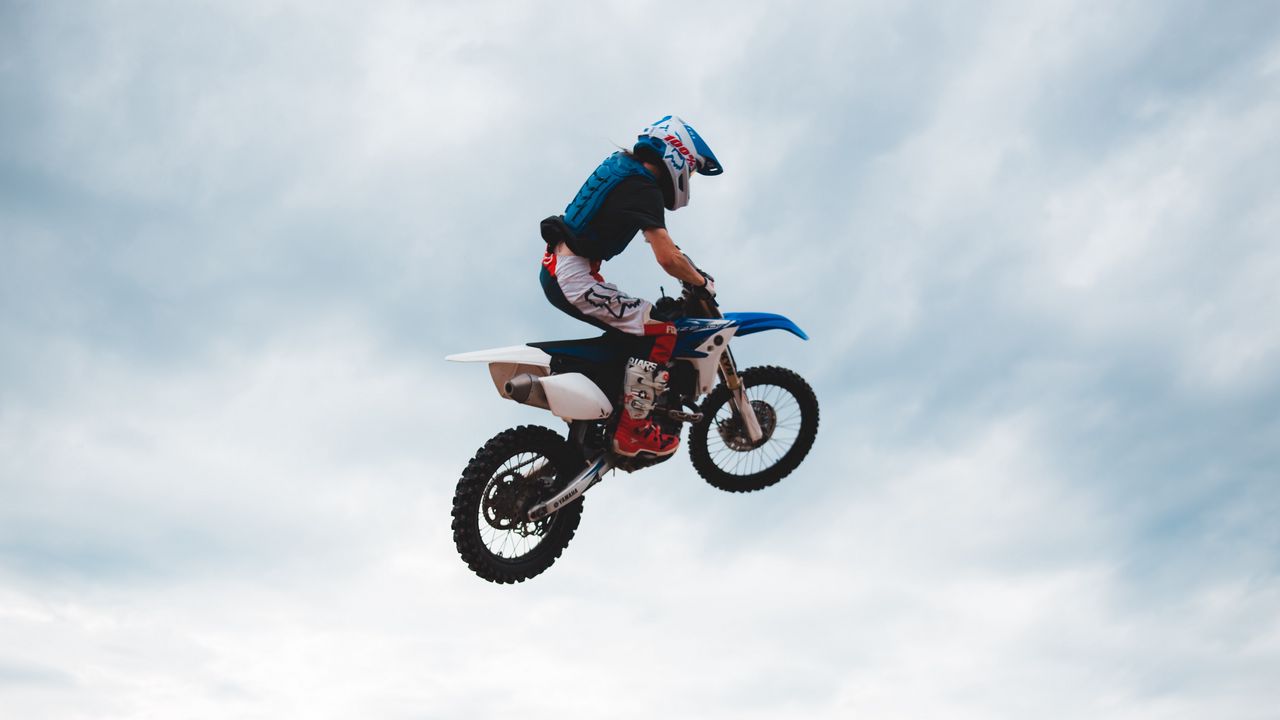 Wallpaper motorcyclist, motorcycle, helmet, stunt, jump