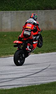 Preview wallpaper motorcyclist, motorcycle, red, motorcycle racing, movement