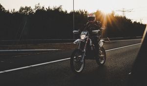 Preview wallpaper motorcyclist, motorcycle, road, movement