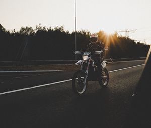 Preview wallpaper motorcyclist, motorcycle, road, movement