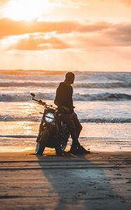 Preview wallpaper motorcyclist, motorcycle, silhouette, sunset, loneliness