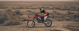 Preview wallpaper motorcyclist, motorcycling, sand