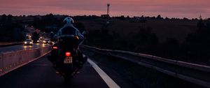 Preview wallpaper motorcyclist, sunset, sky, clouds, road, marking