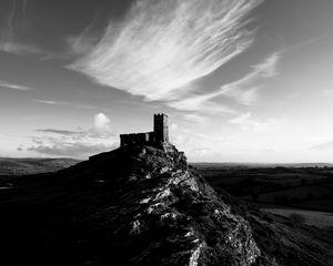 Preview wallpaper mountain, building, tower, sky, black and white