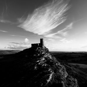 Preview wallpaper mountain, building, tower, sky, black and white