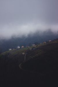 Preview wallpaper mountain, buildings, fog, cloud, aerial view, nature