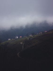 Preview wallpaper mountain, buildings, fog, cloud, aerial view, nature