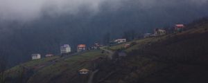 Preview wallpaper mountain, buildings, fog, cloud, aerial view, nature