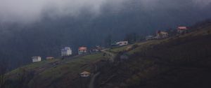 Preview wallpaper mountain, buildings, fog, cloud, aerial view, nature