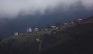 Preview wallpaper mountain, buildings, fog, cloud, aerial view, nature