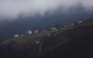 Preview wallpaper mountain, buildings, fog, cloud, aerial view, nature