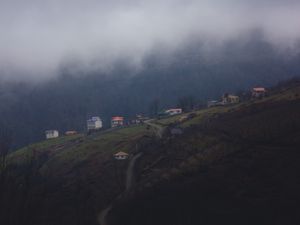 Preview wallpaper mountain, buildings, fog, cloud, aerial view, nature