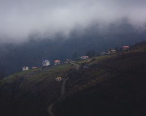 Preview wallpaper mountain, buildings, fog, cloud, aerial view, nature