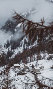 Preview wallpaper mountain, buildings, snow, trees, slope, aerial view